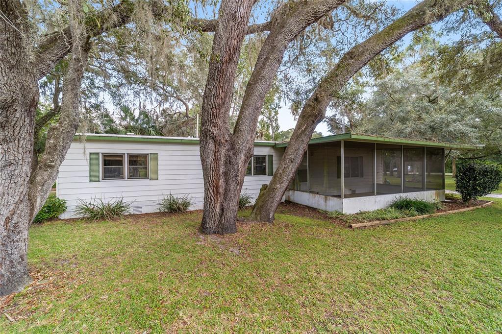 18395 Northwest 4th Terrace Citra, FL 32113 - Photo 47 of 66 a view of a house with a yard and sitting area