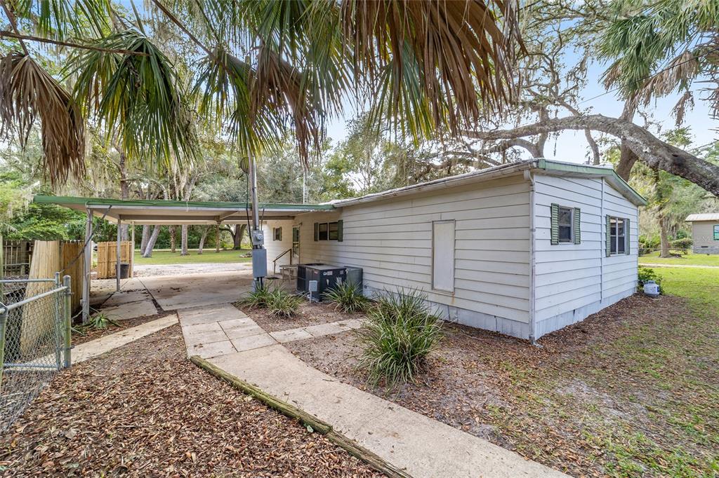 18395 Northwest 4th Terrace Citra, FL 32113 - Photo 53 of 66 a view of a chair and table in the backyard