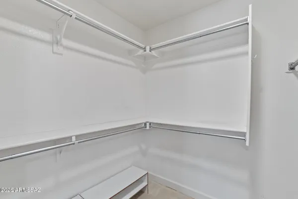 a view of an empty walk in closet