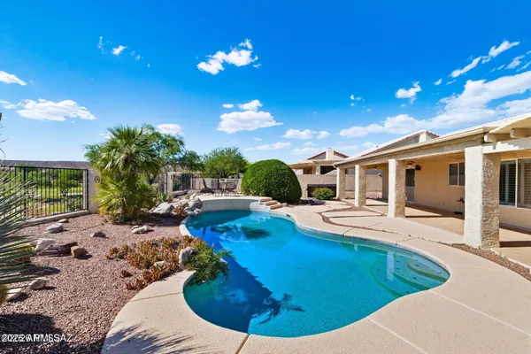 a view of a swimming pool with a patio