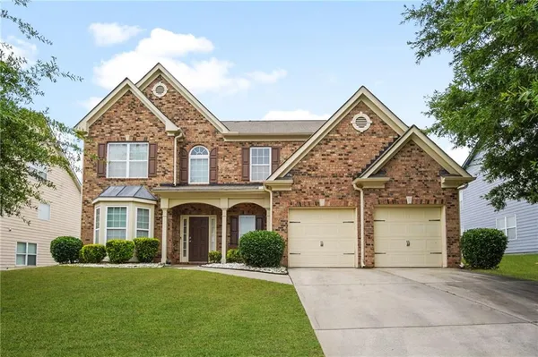 front view of a house with a yard