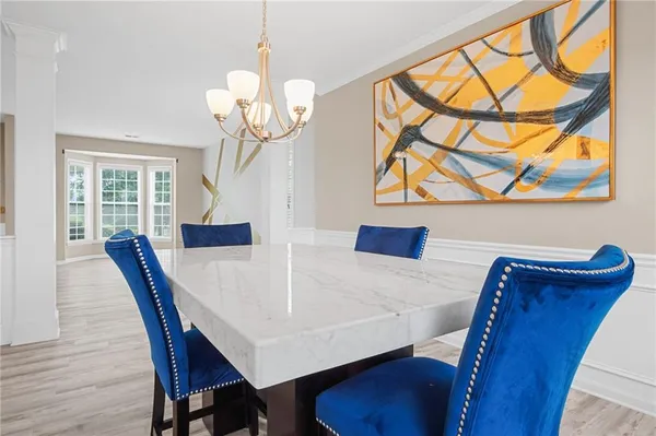 a view of a dining room with furniture and wooden floor