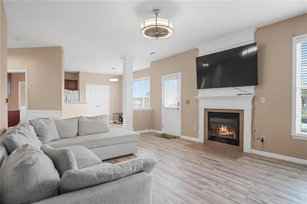 a living room with furniture and a fireplace
