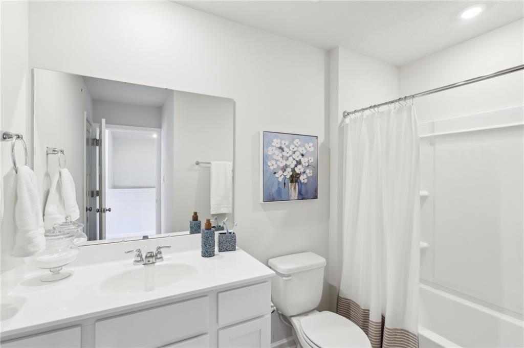 504 Cherry Tree Drive Butler, PA 16001 - Photo 13 of 20 a bathroom with a toilet sink and mirror