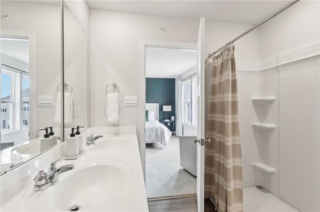 504 Cherry Tree Drive Butler, PA 16001 - Photo 17 of 20 a en suite bathroom with a double vanity sink and mirror