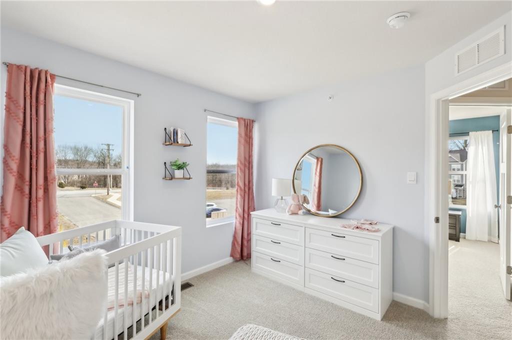504 Cherry Tree Drive Butler, PA 16001 - Photo 10 of 20 a bedroom with a bed and a large window