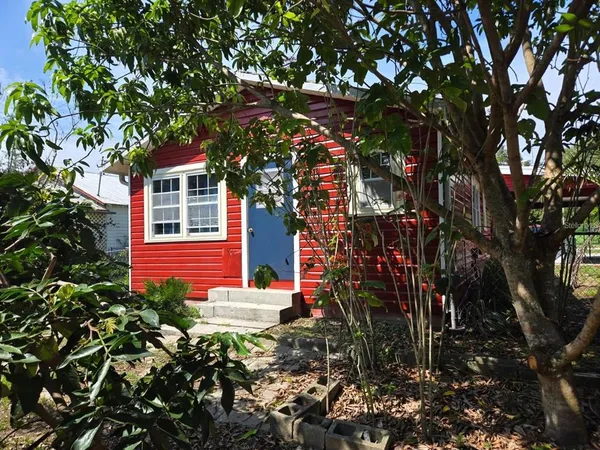 a backyard of a house with lots of green space