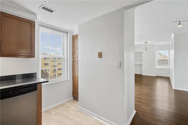 a view of a kitchen cabinets and wooden floor