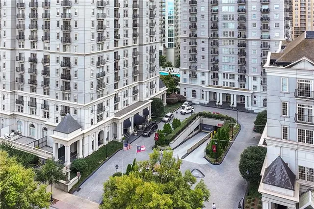 a view of a livingroom with furniture and a floor to ceiling window