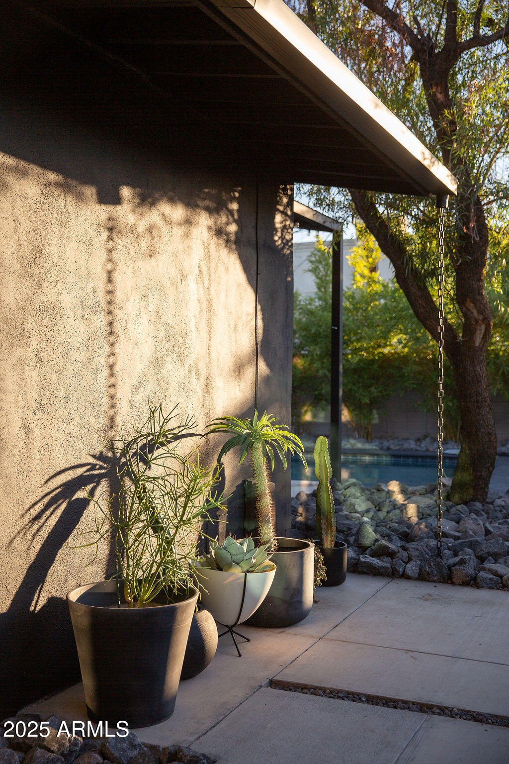 4032 North 45th Place Phoenix, AZ 85018 - Photo 21 of 38 a view of a porch with furniture and a yard