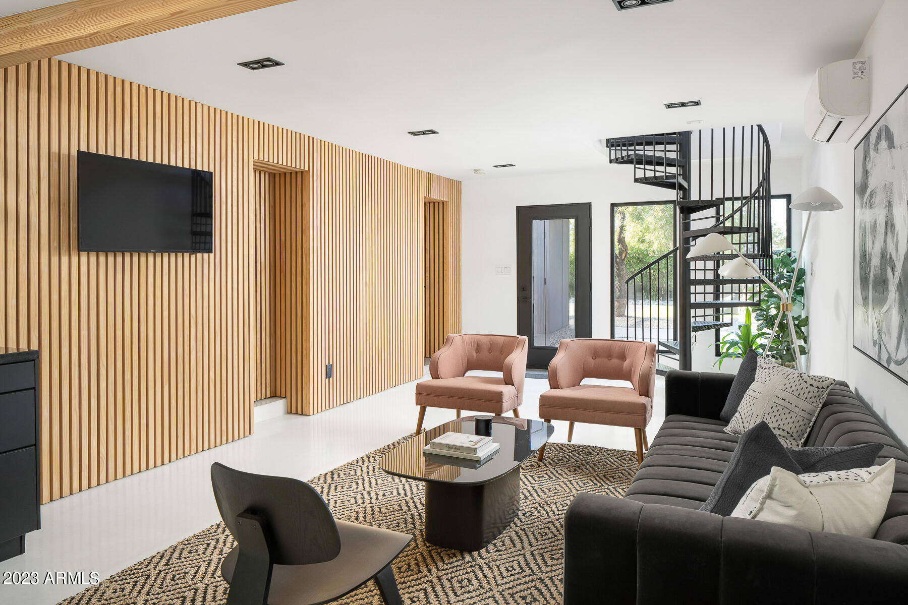 4032 North 45th Place Phoenix, AZ 85018 - Photo 24 of 38 a living room with furniture and a flat screen tv
