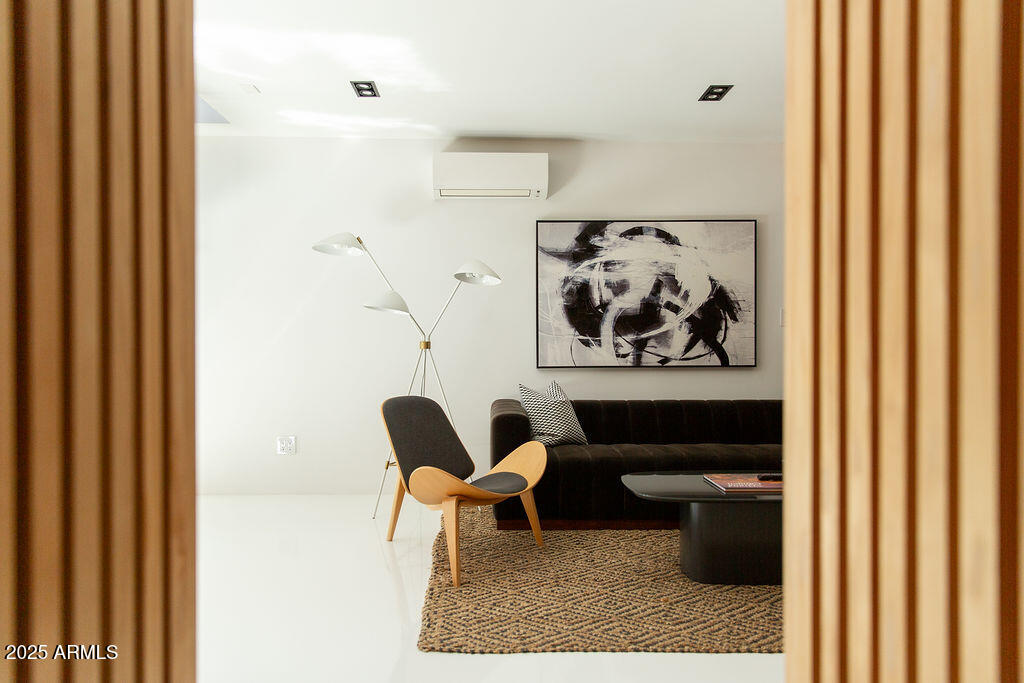 4032 North 45th Place Phoenix, AZ 85018 - Photo 26 of 38 a living room with furniture and a rug