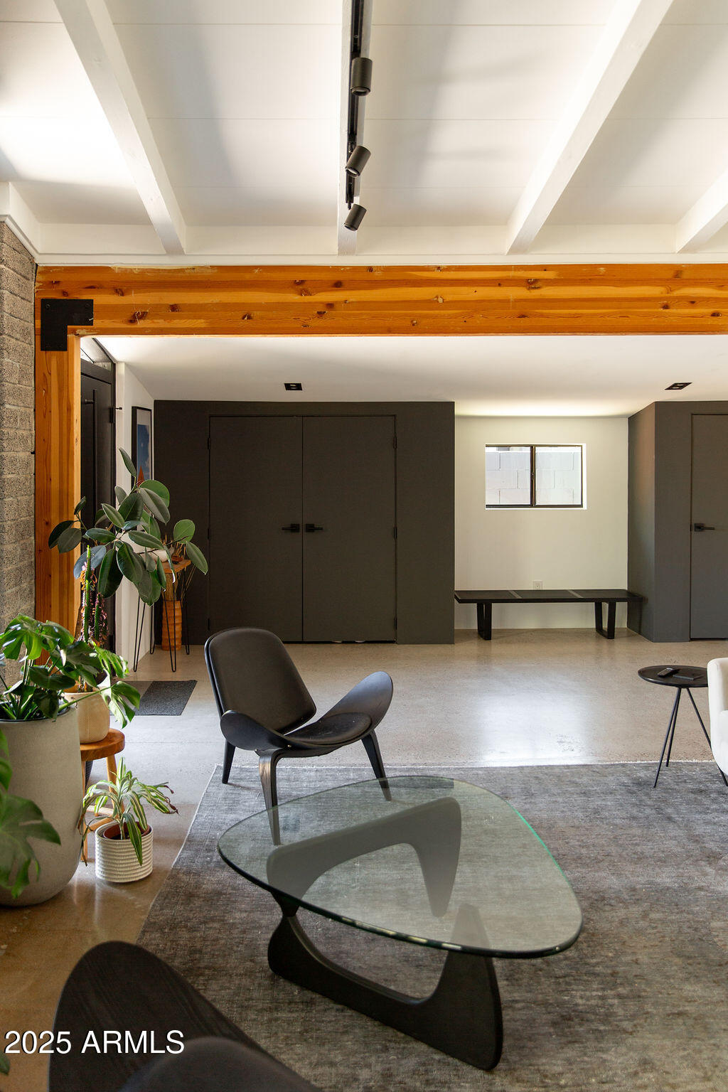 4032 North 45th Place Phoenix, AZ 85018 - Photo 34 of 38 a living room with furniture and a rug