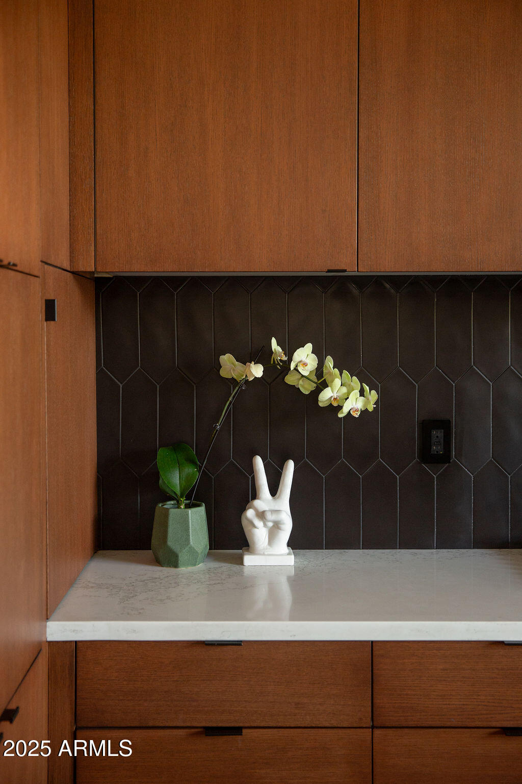 4032 North 45th Place Phoenix, AZ 85018 - Photo 35 of 38 a view of a vase of flowers sitting on a shelf