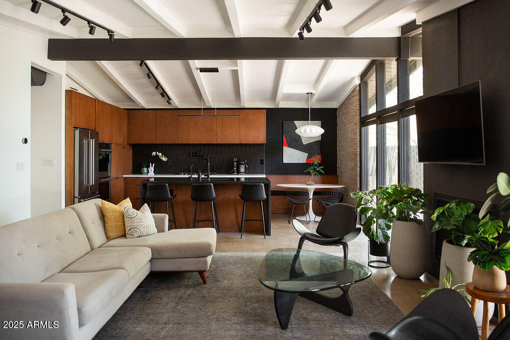 4032 North 45th Place Phoenix, AZ 85018 - Photo 7 of 38 a living room with furniture a window and a potted plant