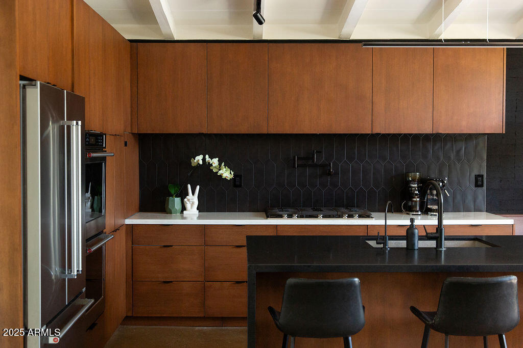 4032 North 45th Place Phoenix, AZ 85018 - Photo 10 of 38 a kitchen with a sink cabinets and appliances