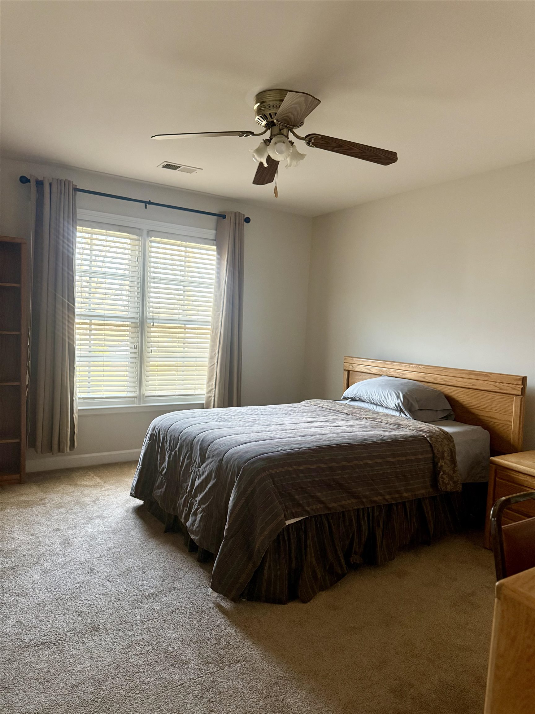 7935 Oak Spring Cove Millington, TN 38053 - Photo 22 of 39 a spacious bedroom with a bed and window
