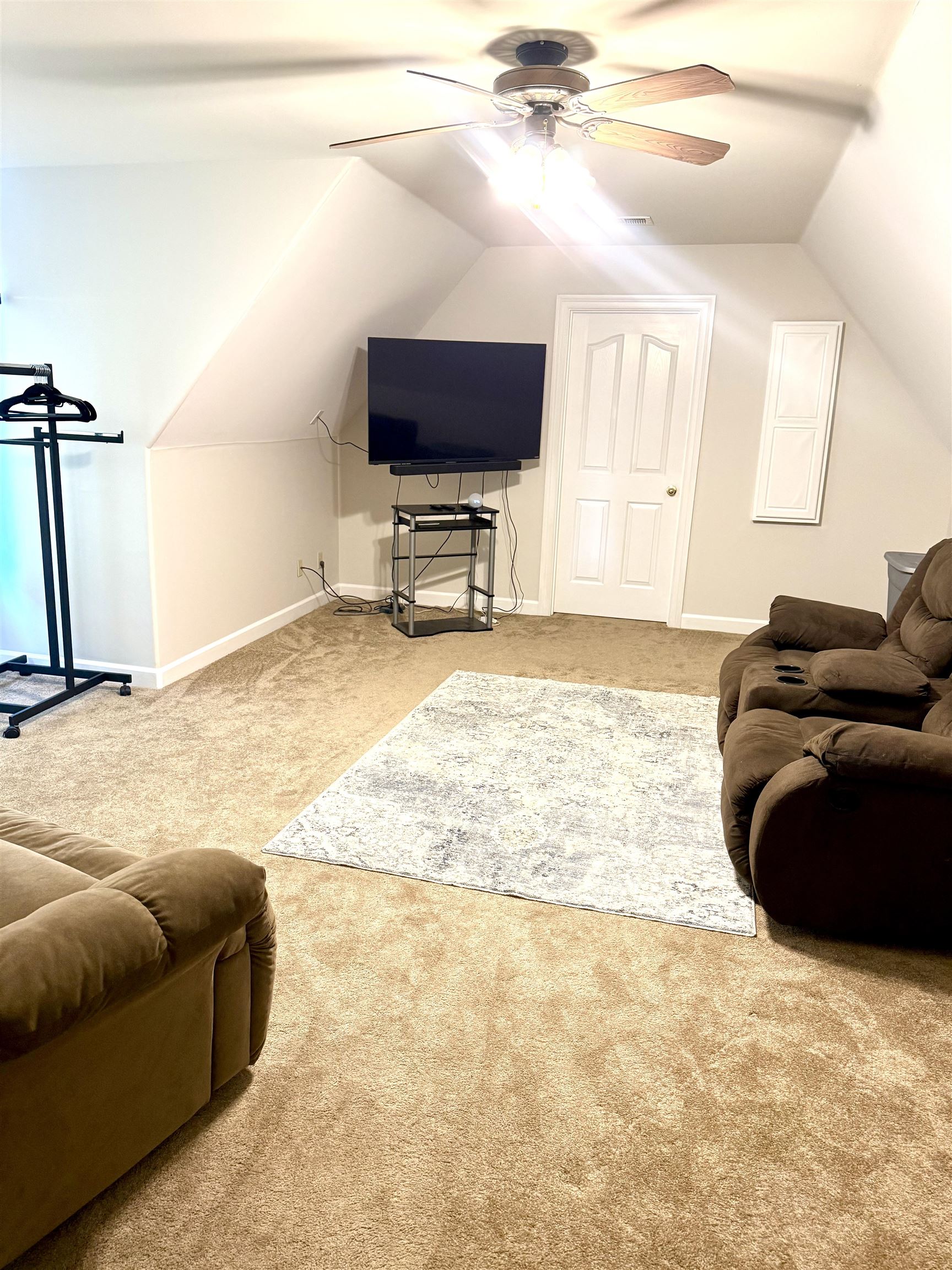 7935 Oak Spring Cove Millington, TN 38053 - Photo 27 of 39 a room with furniture and a flat screen tv