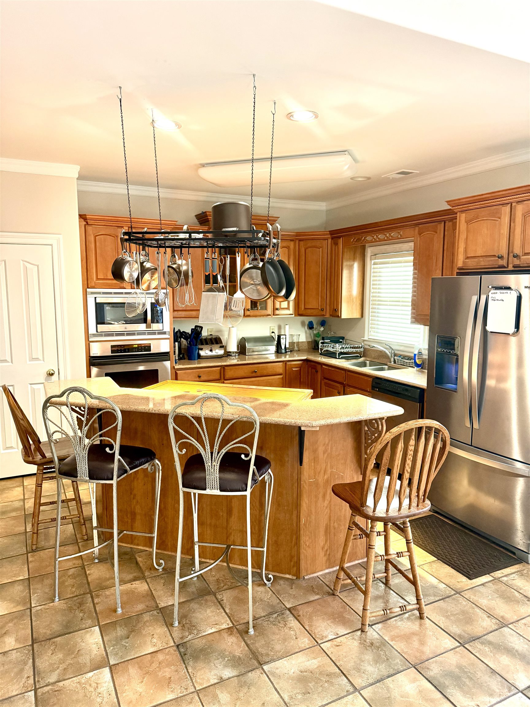 7935 Oak Spring Cove Millington, TN 38053 - Photo 7 of 39 a dining area with furniture and a floor to ceiling window
