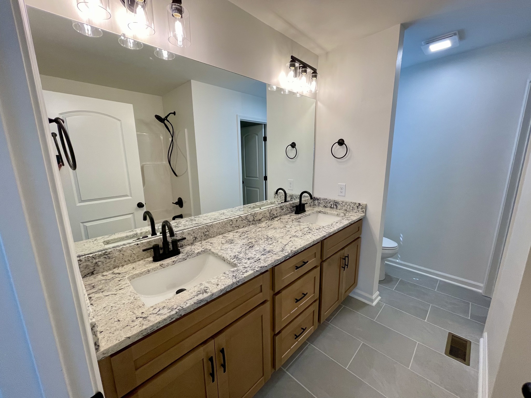 104 Donald Road Lafayette, TN 37083 - Photo 15 of 22 a bathroom with a granite countertop sink and a mirror