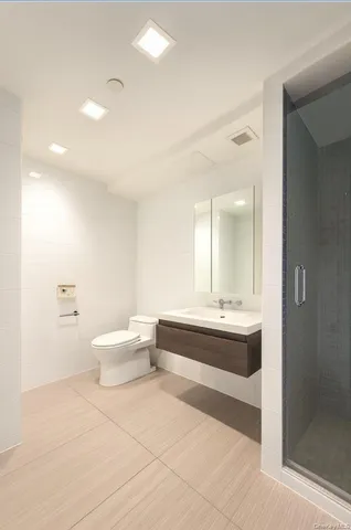 a spacious bathroom with a bathtub sink and toilet