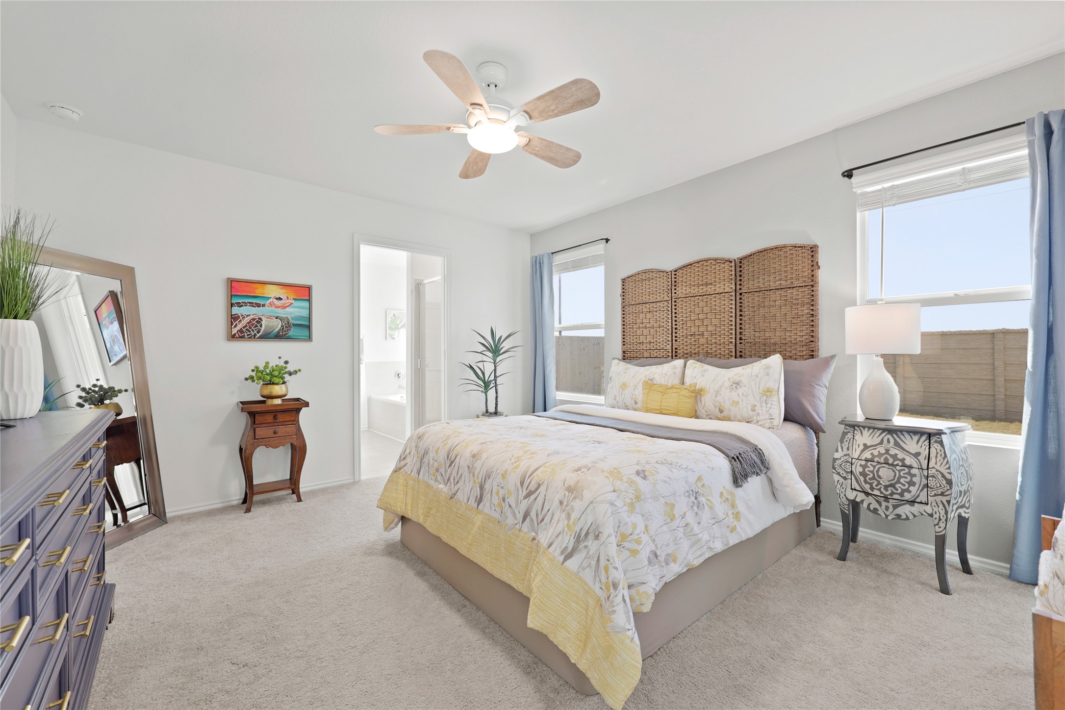 1073 Soapstone Pass Maxwell, TX 78656 - Photo 11 of 28 a bedroom with a bed and a large mirror with a chandelier