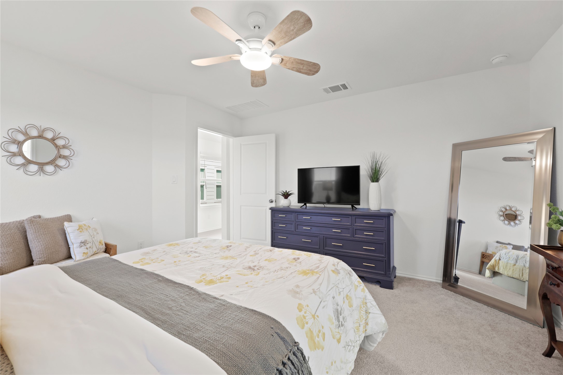 1073 Soapstone Pass Maxwell, TX 78656 - Photo 13 of 28 a bedroom with a bed and a flat screen tv