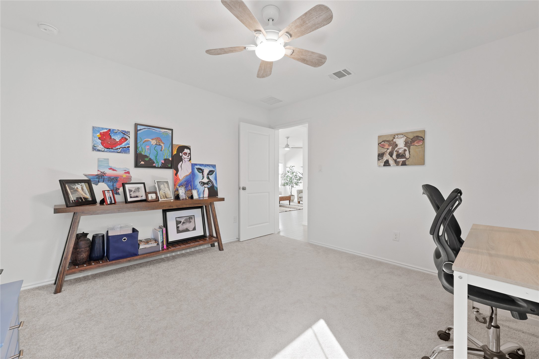 1073 Soapstone Pass Maxwell, TX 78656 - Photo 18 of 28 a bedroom with furniture and a chandelier