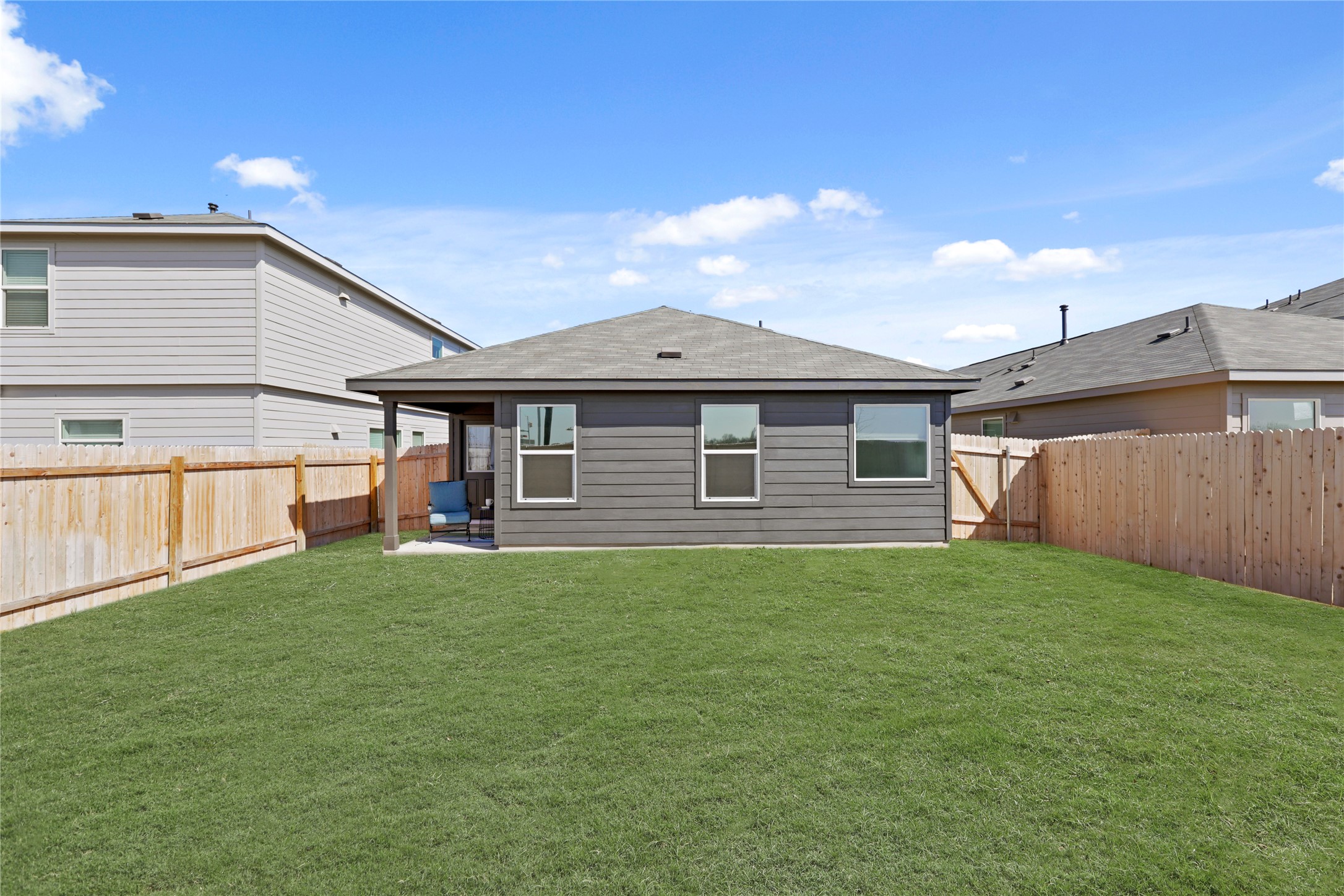 1073 Soapstone Pass Maxwell, TX 78656 - Photo 25 of 28 a front view of a house with a garden