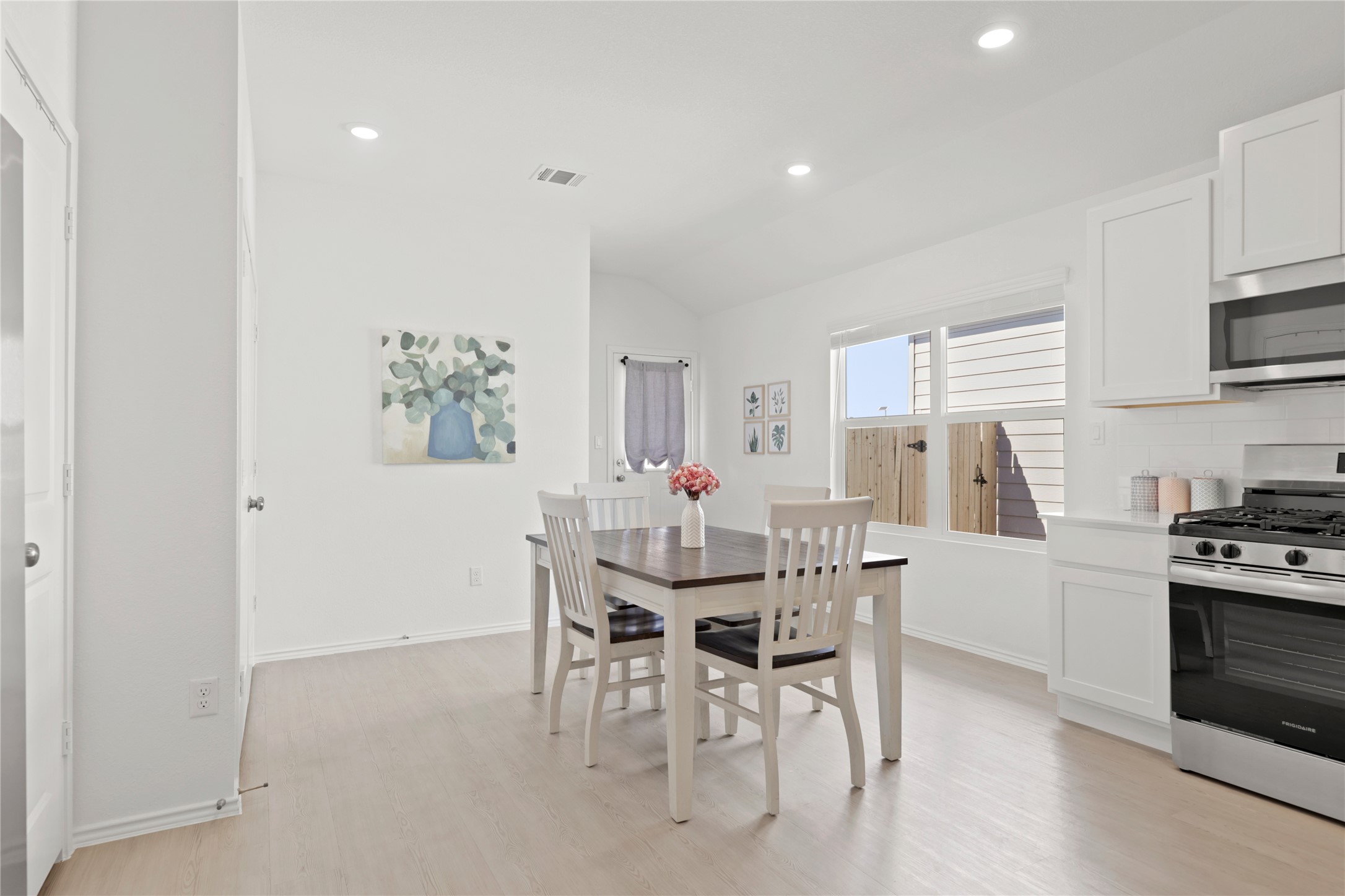 1073 Soapstone Pass Maxwell, TX 78656 - Photo 9 of 28 a view of a dining room with furniture and wooden floor