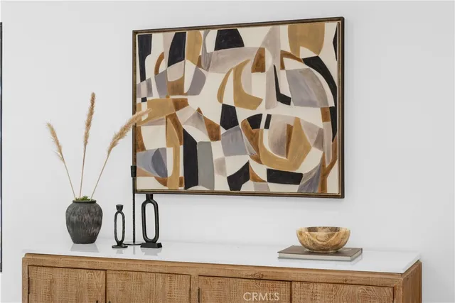 a living room with furniture and floor to ceiling windows