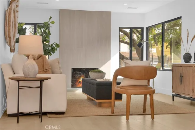 a bedroom with a large bed and a potted plant