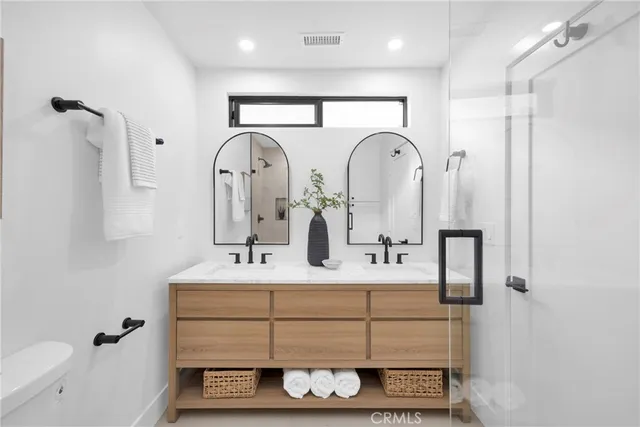 a bathroom with a shower and toilet
