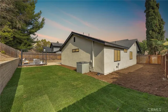 a view of a patio with a table and chairs