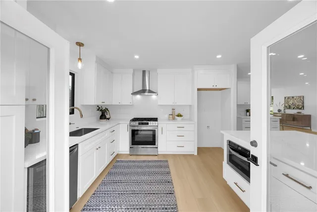 a kitchen with a sink and appliances