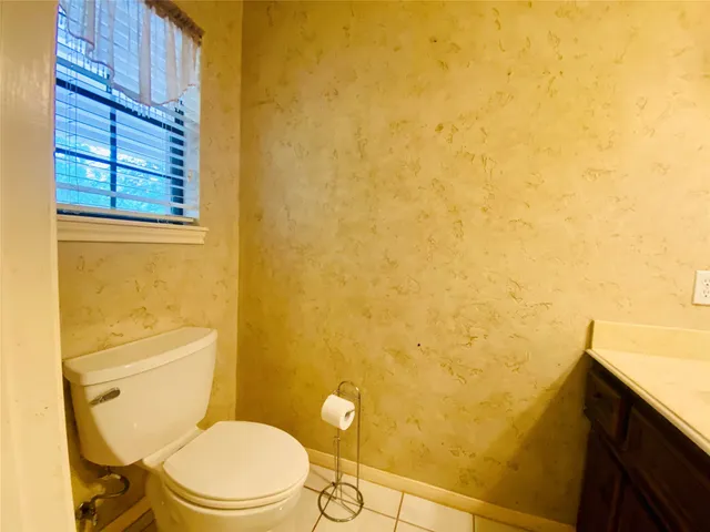 a view of a house with basketball court