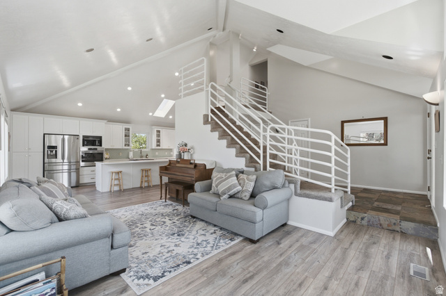 5788 Walden Ridge Drive Murray, UT 84123 - Photo 1 of 29 Vaulted ceilings with recessed lighting and skylight define this open-concept living space