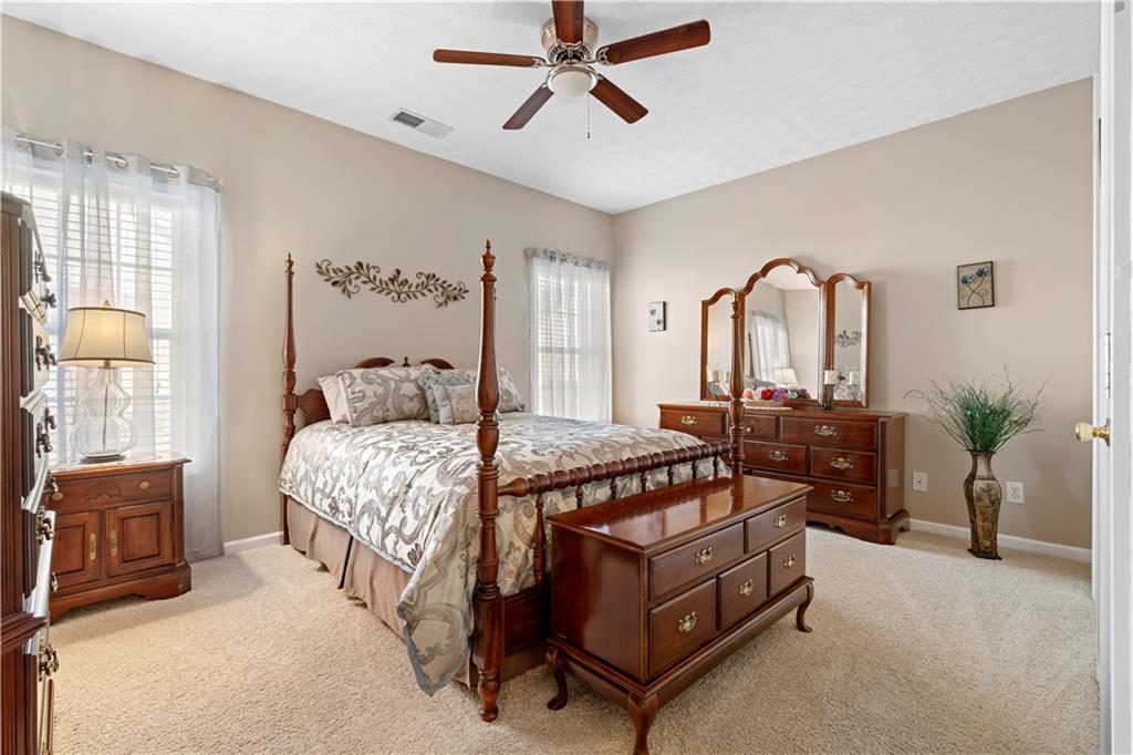 3731 Villa Springs Circle Powder Springs, GA 30127 - Photo 25 of 34 a bedroom with a bed a couch and dresser