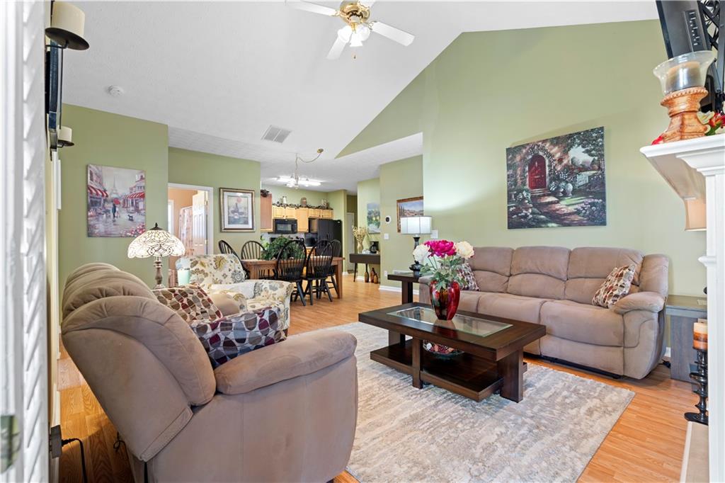 3731 Villa Springs Circle Powder Springs, GA 30127 - Photo 6 of 34 a living room with furniture and a chandelier