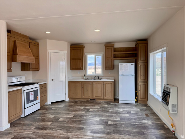 32 Sevier River, Unit 32 Levan, UT 84639 - Photo 3 of 50 Kitchen with white appliances, light countertops, recessed lighting, dark wood-type flooring