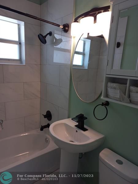 1861 Northeast 161st Street North Miami Beach, FL 33162 - Photo 11 of 32 a bathroom with a sink toilet and shower