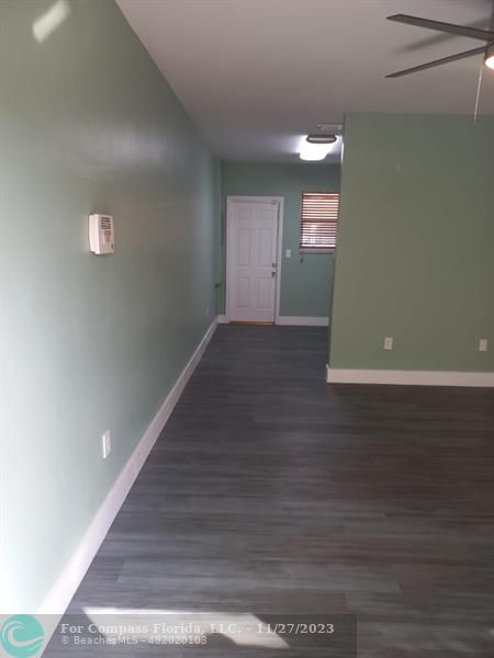 1861 Northeast 161st Street North Miami Beach, FL 33162 - Photo 21 of 32 a view of wooden floor and windows in an empty room