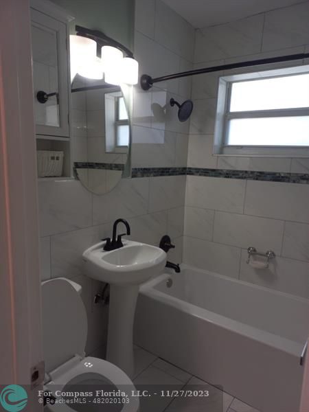 1861 Northeast 161st Street North Miami Beach, FL 33162 - Photo 32 of 32 a bathroom with a sink a toilet and shower