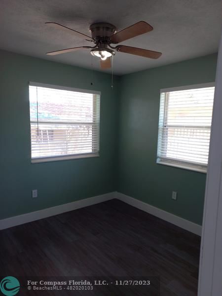 1861 Northeast 161st Street North Miami Beach, FL 33162 - Photo 5 of 32 a view of a room with wooden floor and windows
