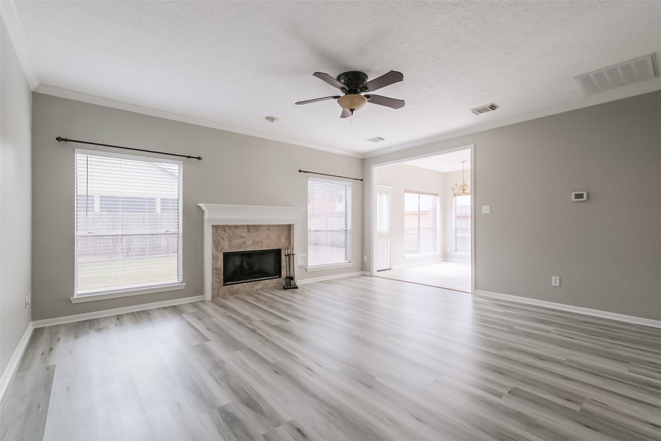 7603 Quintero Drive Houston, TX 77083 - Photo 11 of 36 a view of an empty room with a window and fireplace