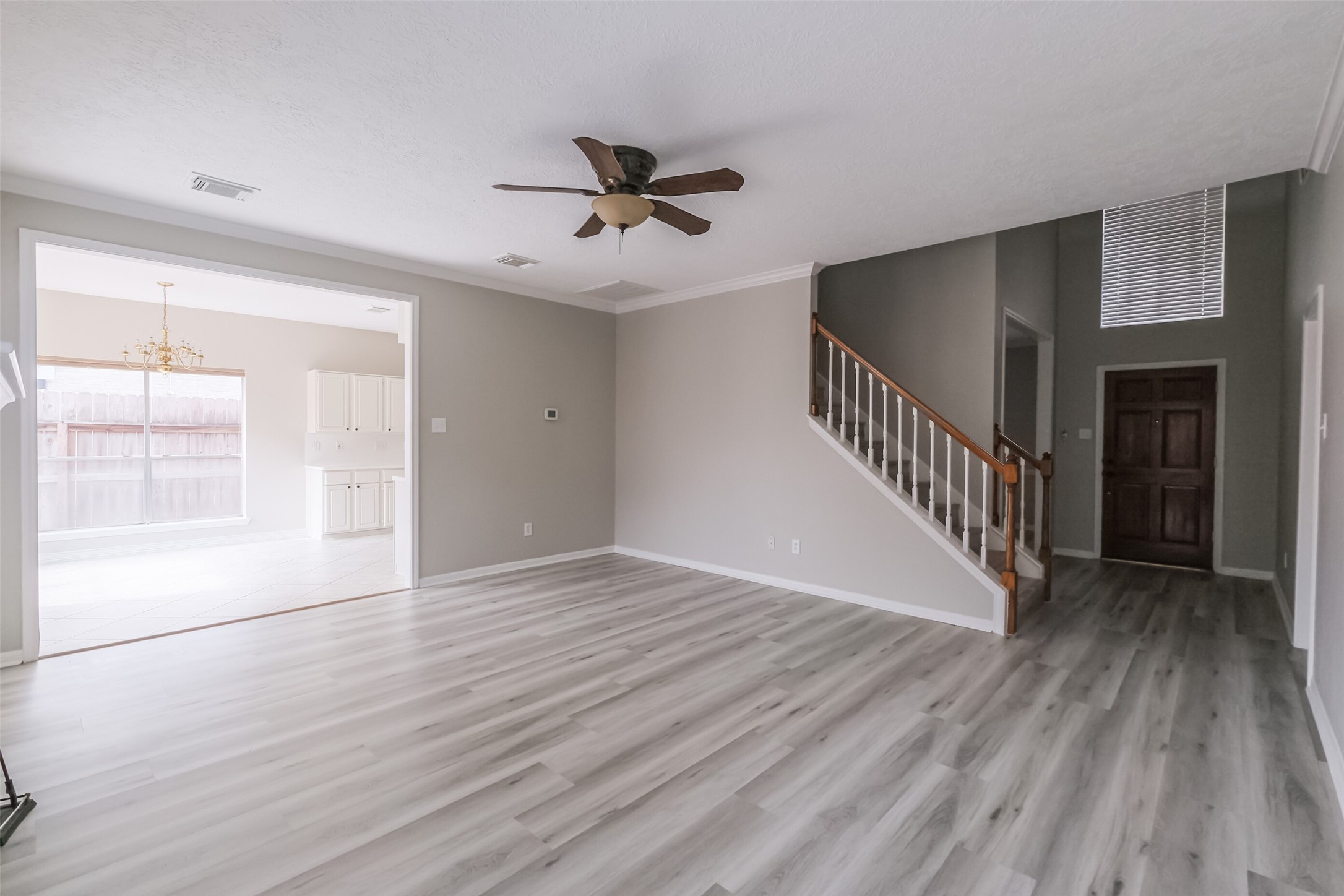 7603 Quintero Drive Houston, TX 77083 - Photo 12 of 36 a view of an empty room with wooden floor and a window