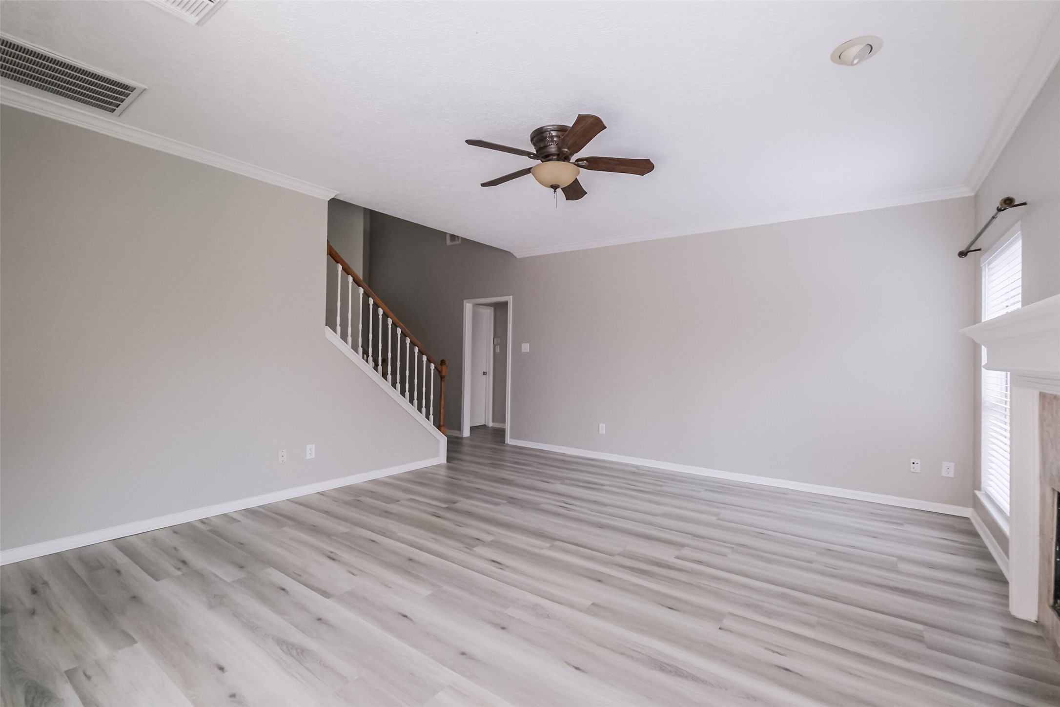 7603 Quintero Drive Houston, TX 77083 - Photo 13 of 36 a view of an empty room with wooden floor and a window