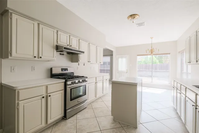 a kitchen that has a sink and a window