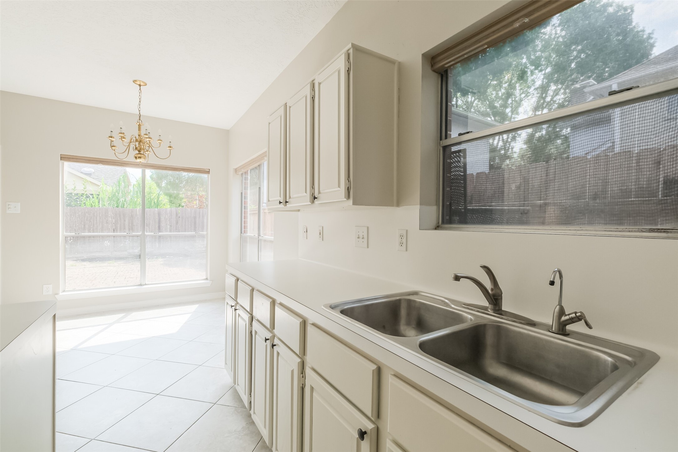 7603 Quintero Drive Houston, TX 77083 - Photo 17 of 36 a kitchen that has a sink and a window