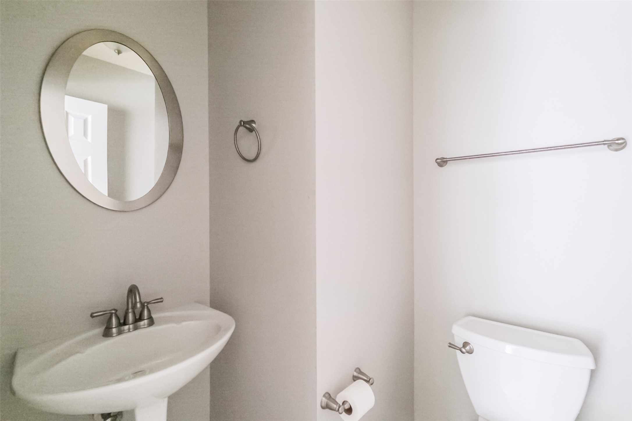 7603 Quintero Drive Houston, TX 77083 - Photo 21 of 36 a bathroom with a toilet sink and mirror